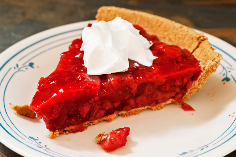 Strawberry Pie with graham cracker crust and whipped cream on top