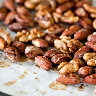 Spiced almonds and walnuts on a baking sheet