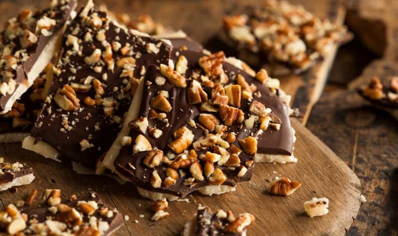 Chocolate Toffee Nut Squares on a cutting board