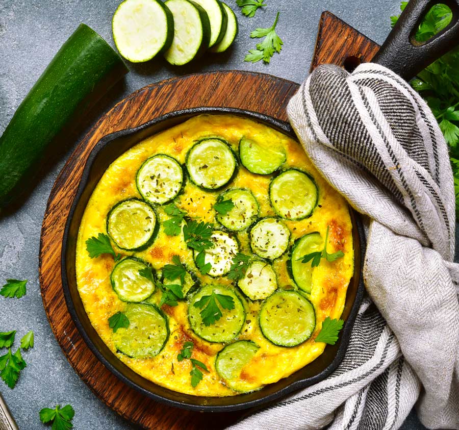 Savory Cheesy Squash and Egg Skillet in a cast iron pan