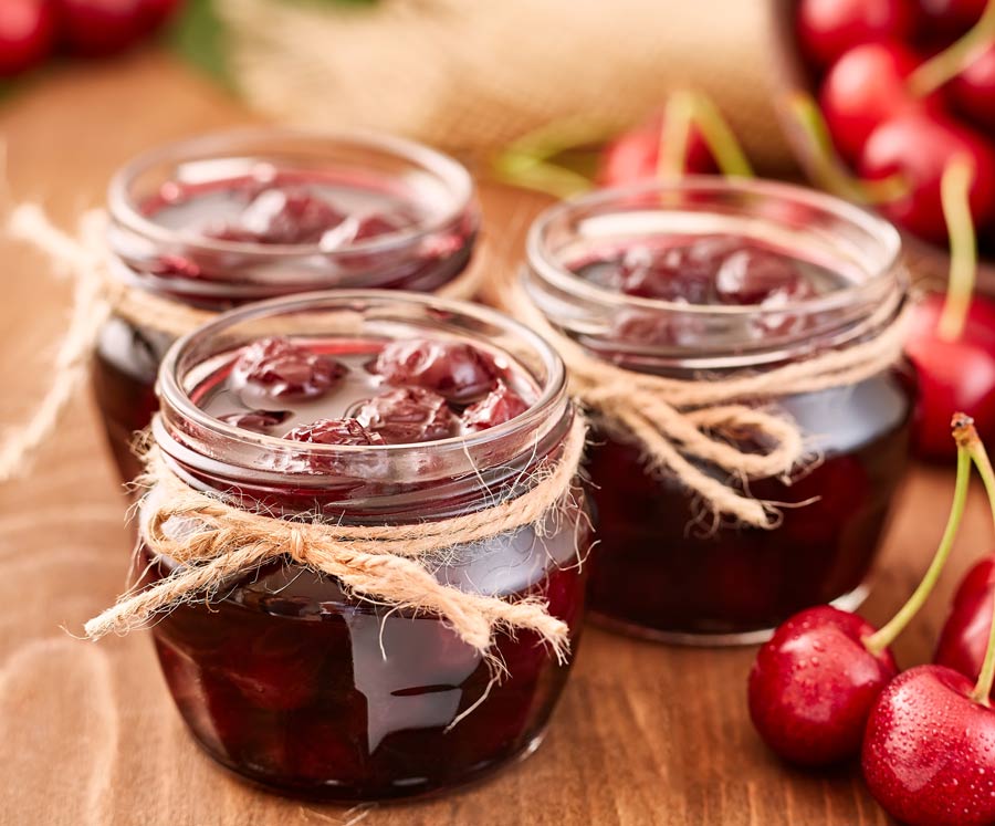 Cherry jam in glass jars